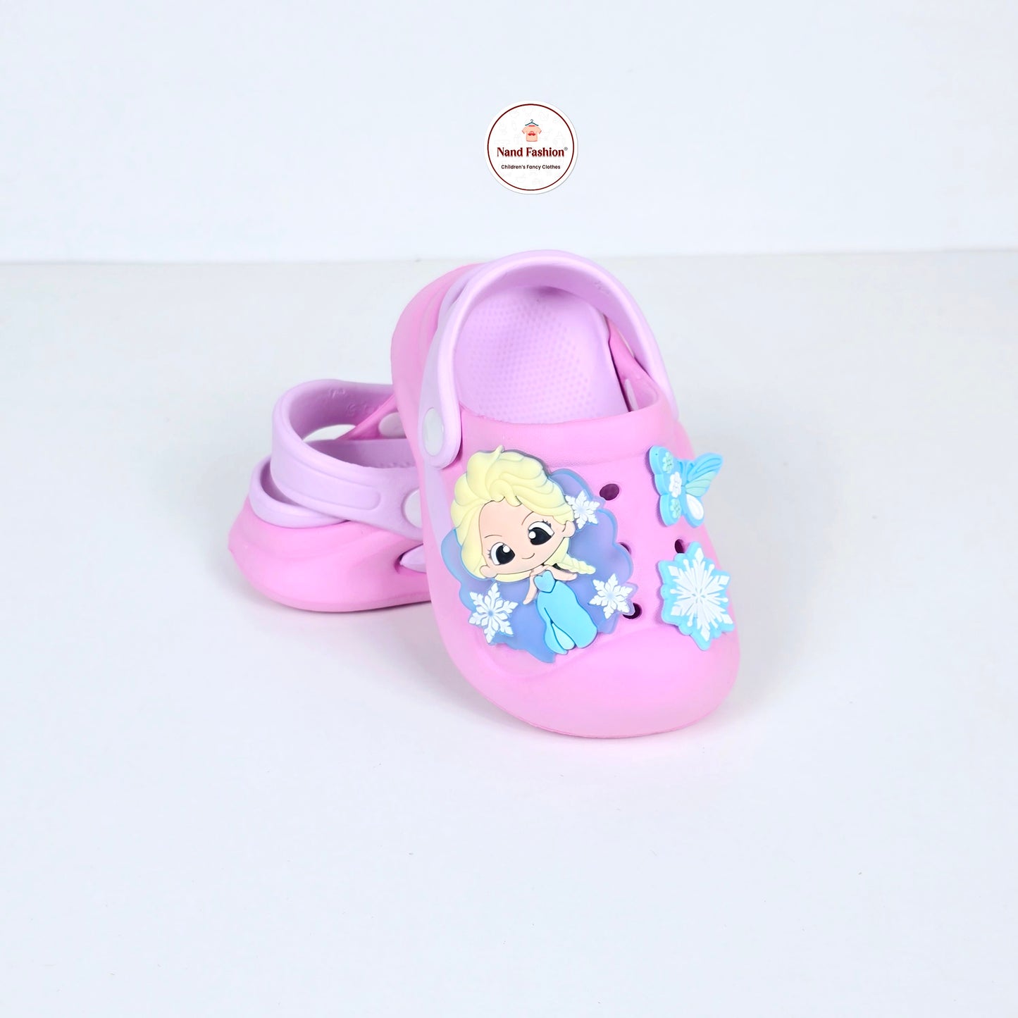 lavender, pink and peach crocs with cartoon and butterfly pattern