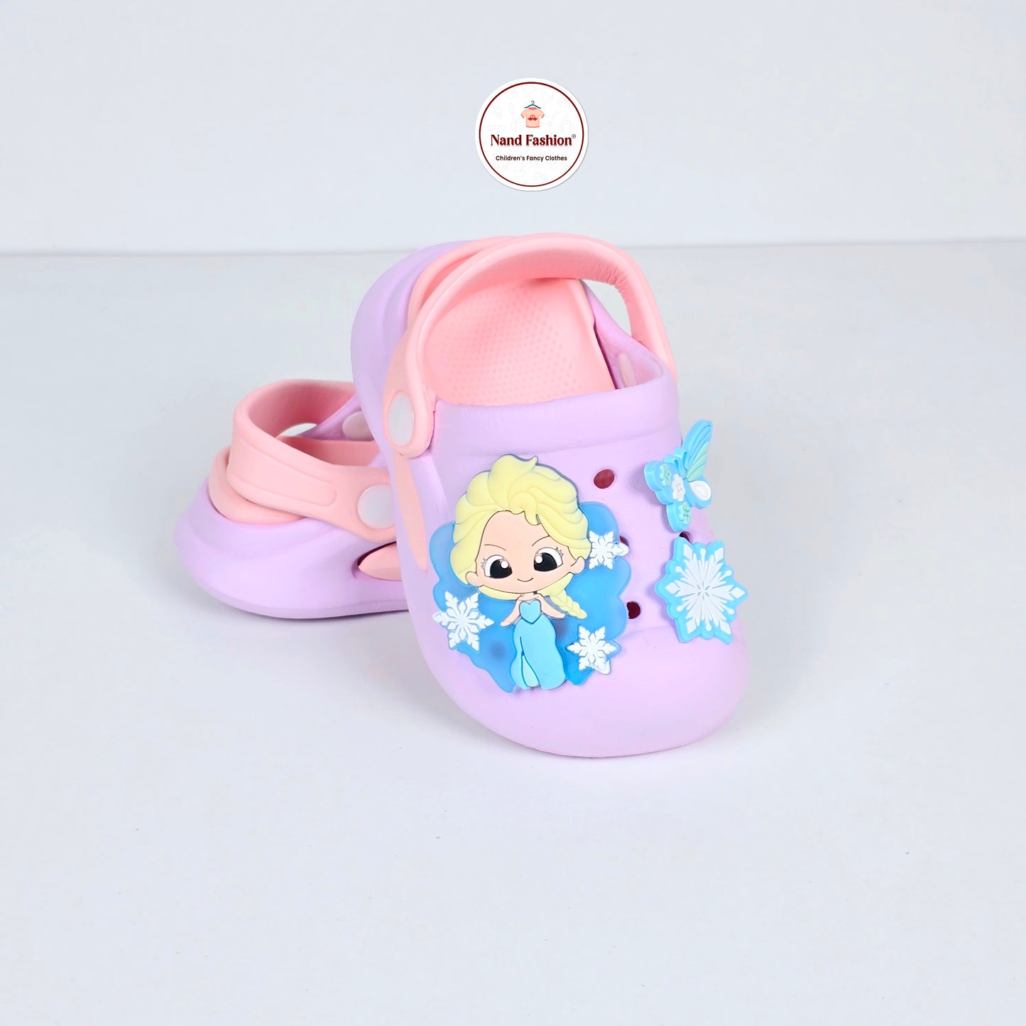 lavender, pink and peach crocs with cartoon and butterfly pattern