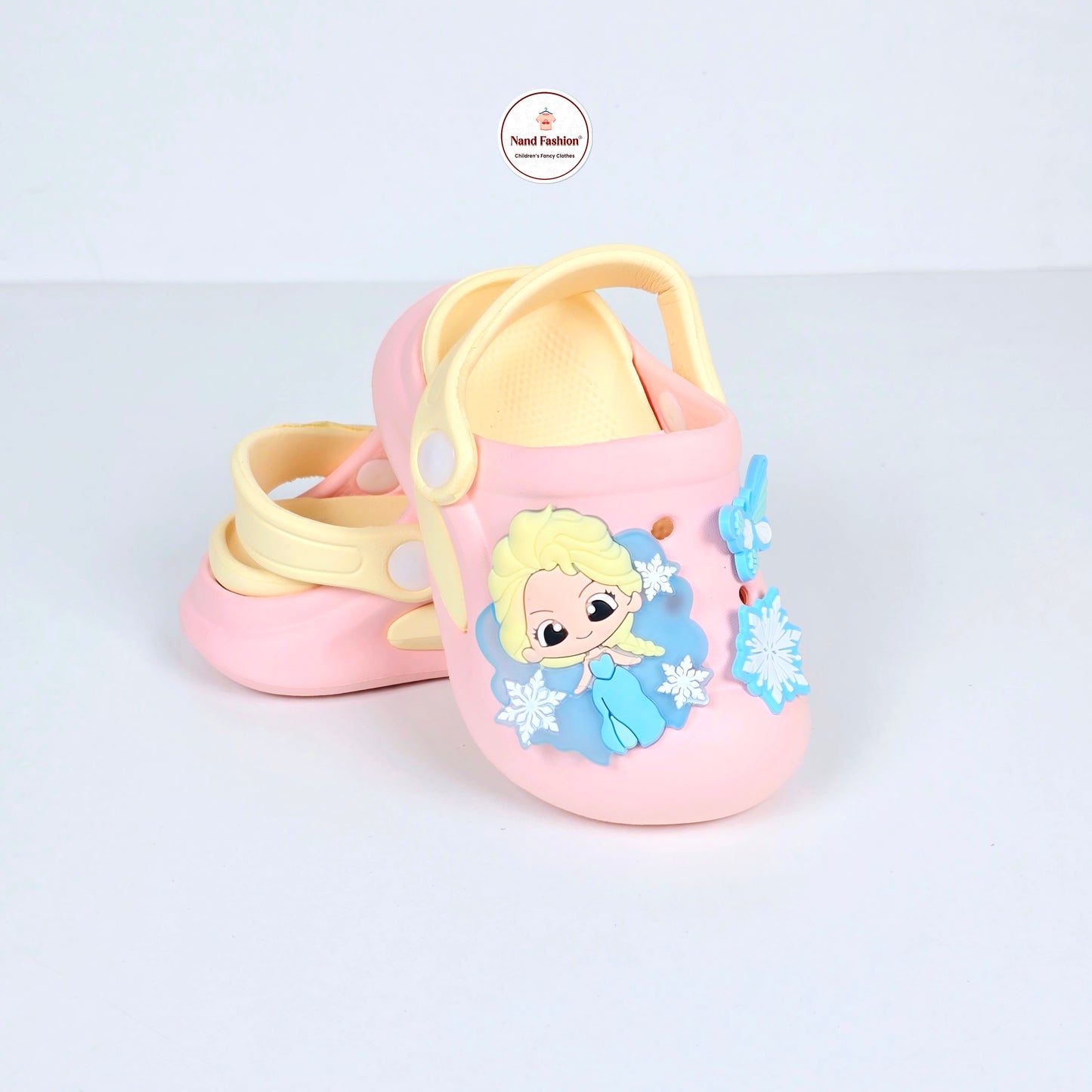 lavender, pink and peach crocs with cartoon and butterfly pattern