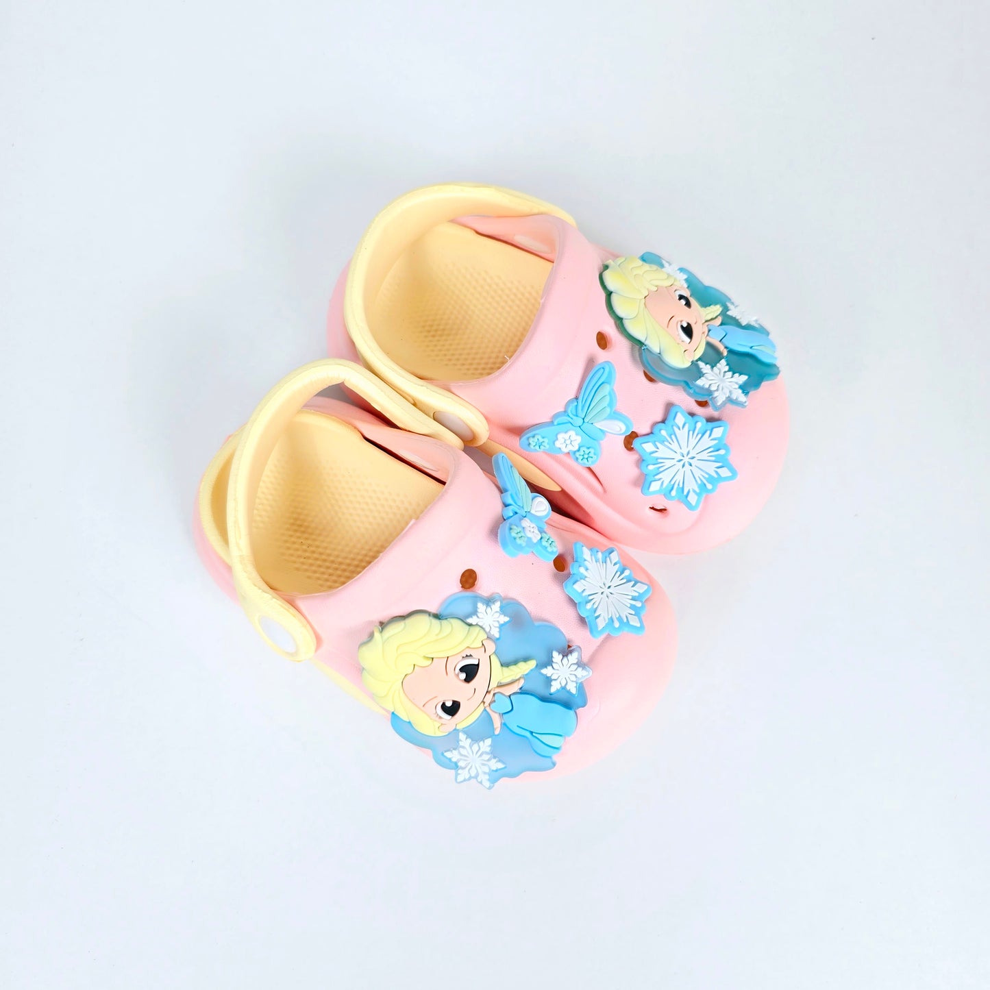 lavender, pink and peach crocs with cartoon and butterfly pattern